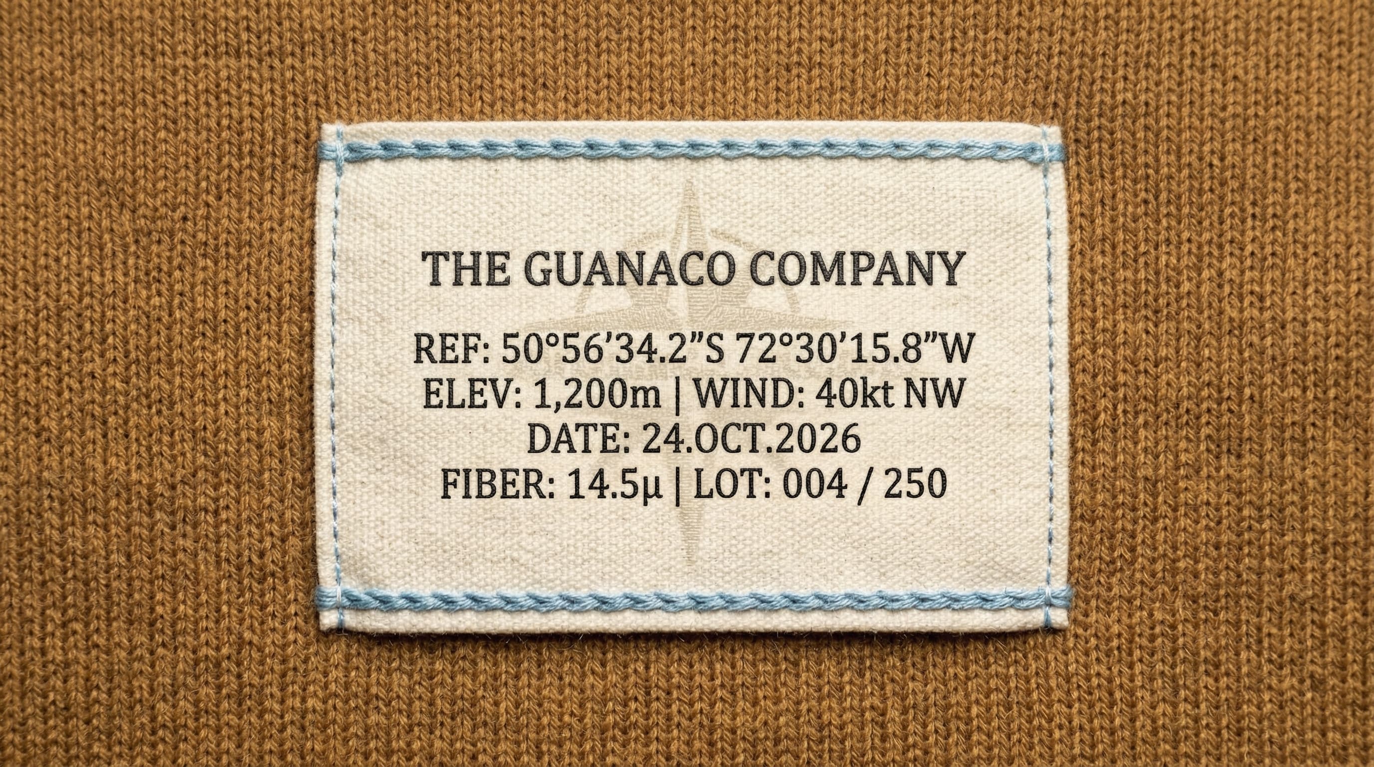 The Guanaco Company garment label detail with coordinates, elevation, wind, date, and lot number
